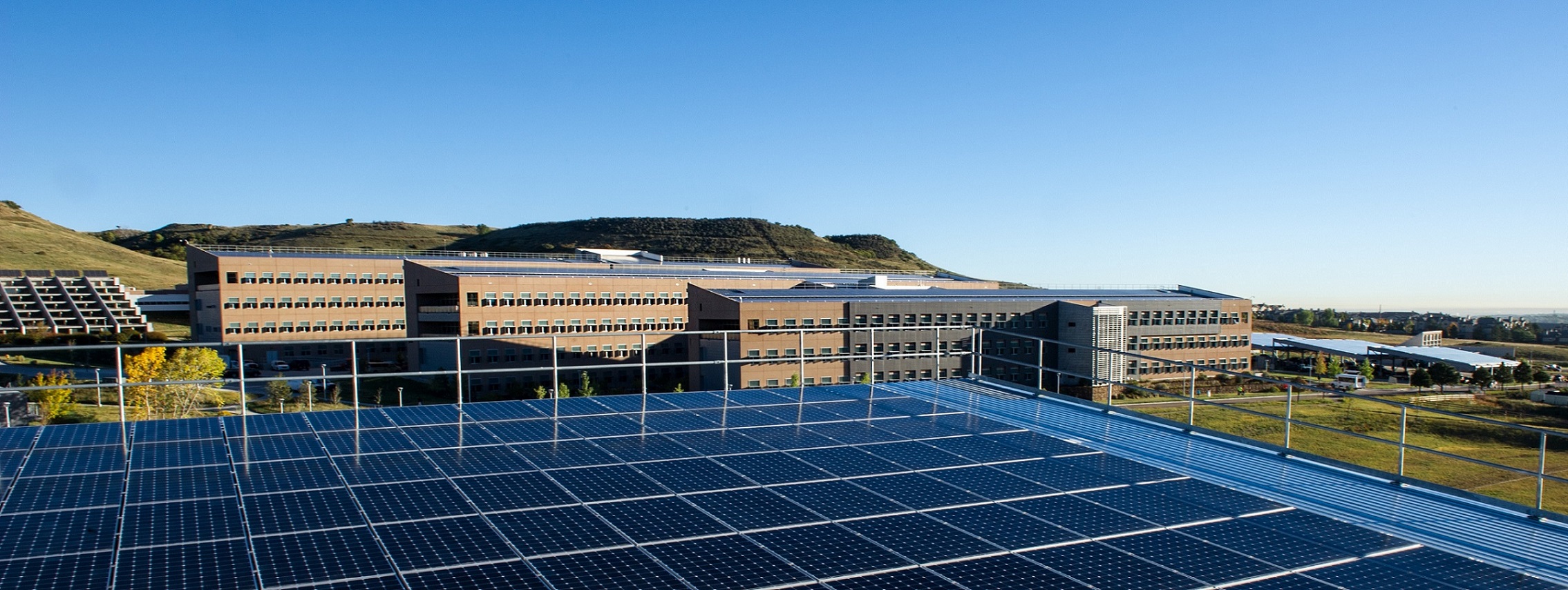October 7, 2013 - NREL's sustainable STM campus showing the SunPower PV array atop of the Parking Garage, overlooking the SERF, Cafe and RSF.  (Photo by Dennis Schroeder / NREL)