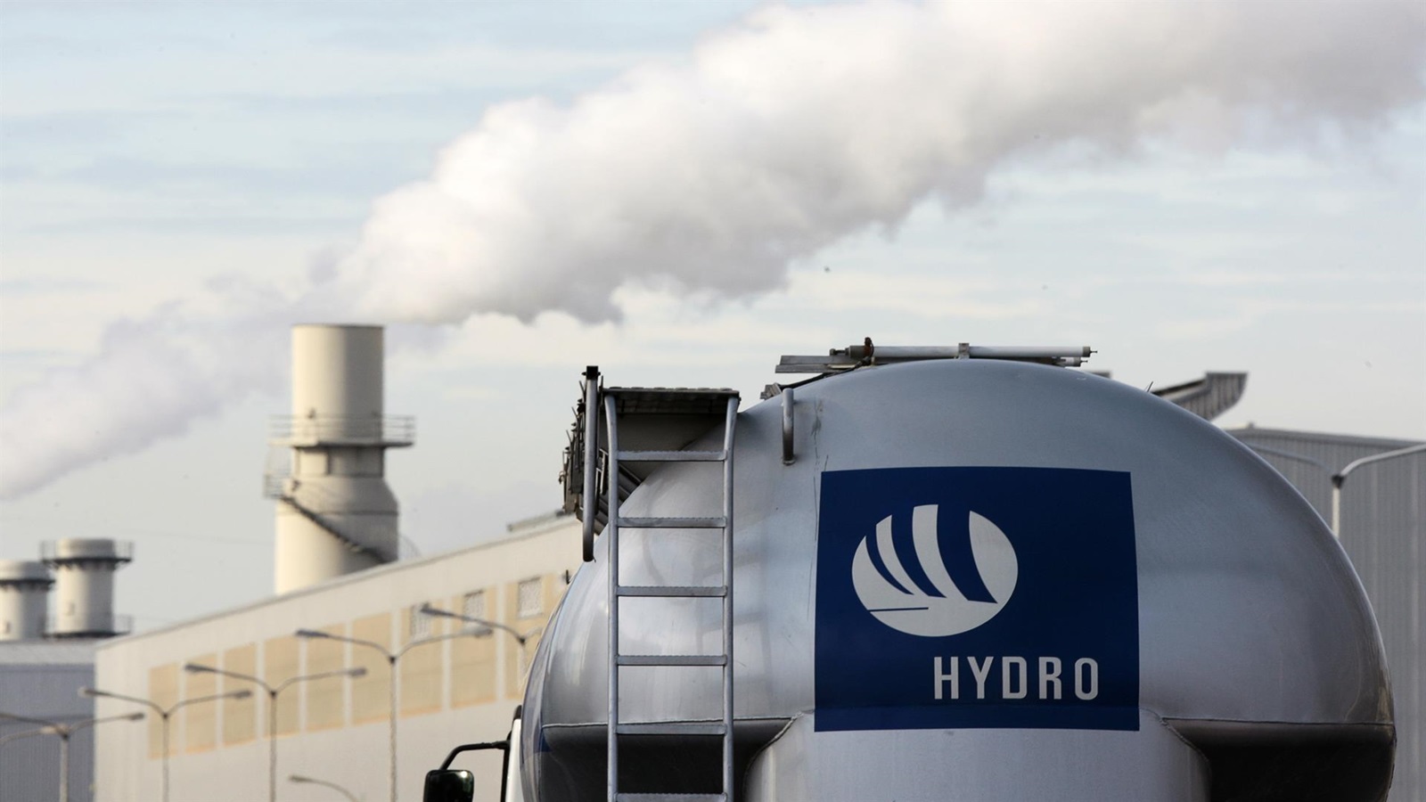 A liquid metal transporter with Hydro lettering drives onto the site of the Norwegian energy firm Norsk Hydro aluminum smelter in Neuss.